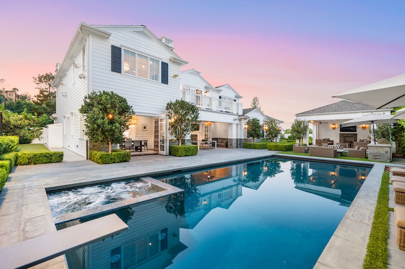 A swimming pool in front of a new construction home in Encino, California