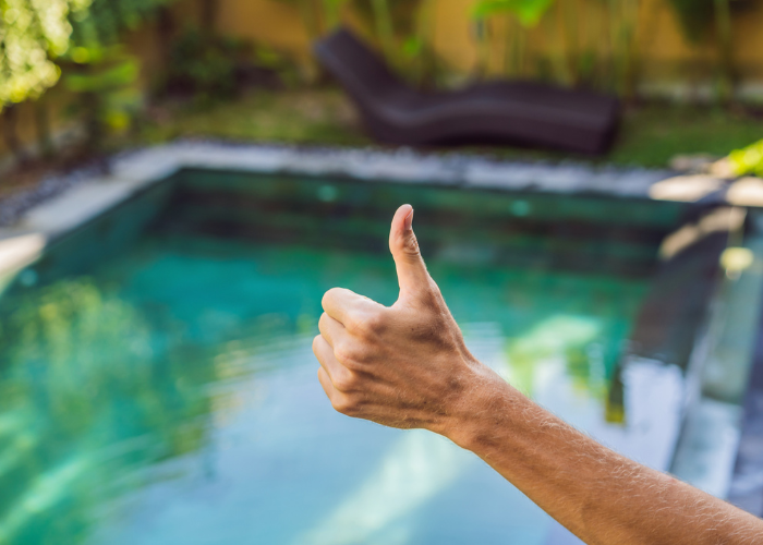 thumbs up over clean pool