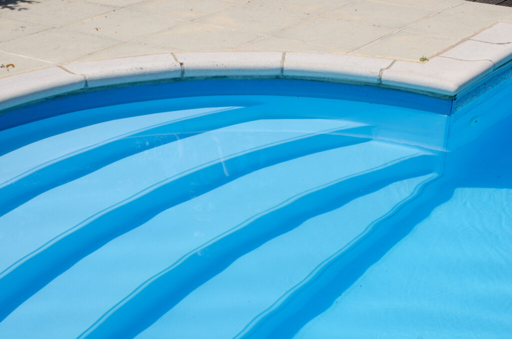 Steps going down into a domestic swimming pool