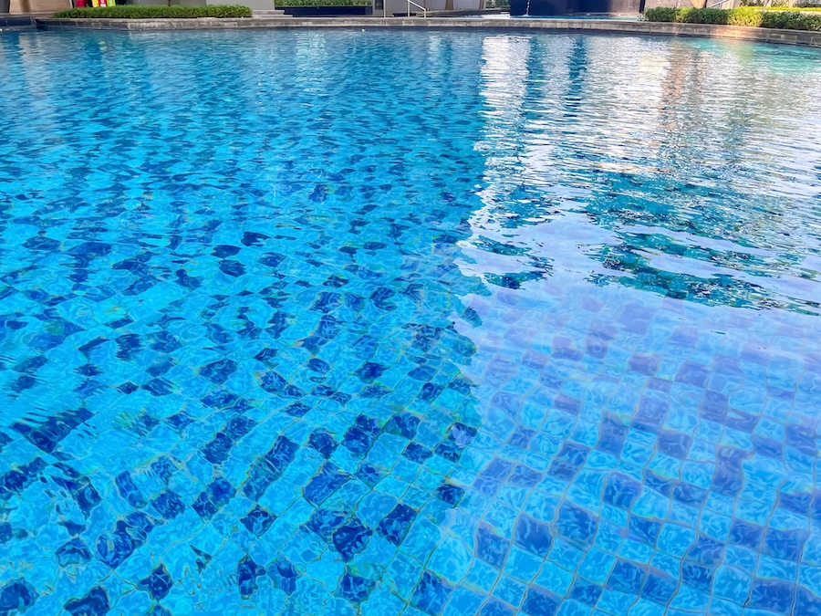 Beautiful Blue Swimming Pool with Reflections of Water Ripples