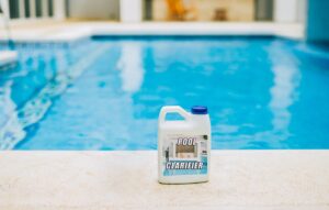 Clarifier on the edge of a crystal clear swimming pool