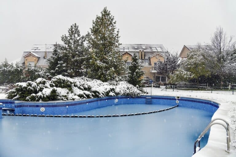 Snow covered yard in a beautiful neigborhood