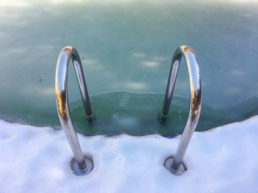 frozen swimming pool which is starting to melt