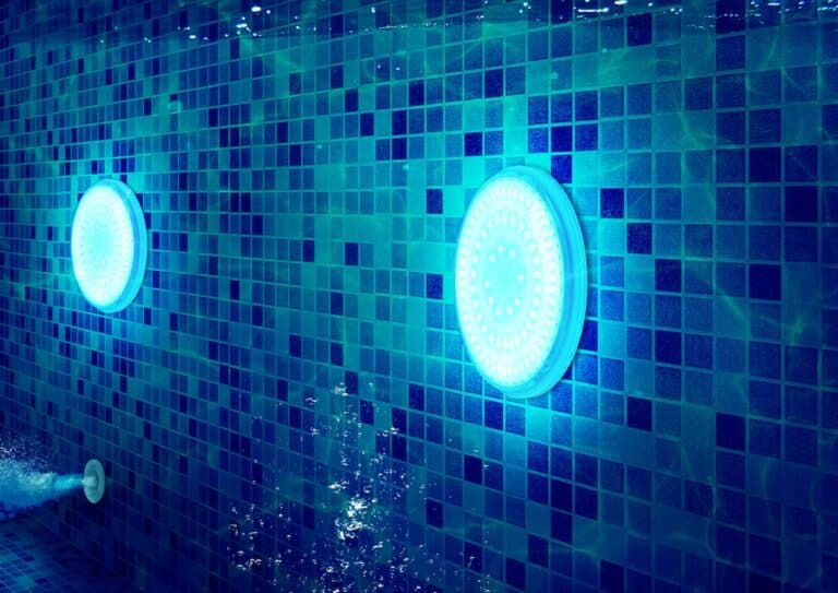 Underwater swimming pool light in tile pool walls
