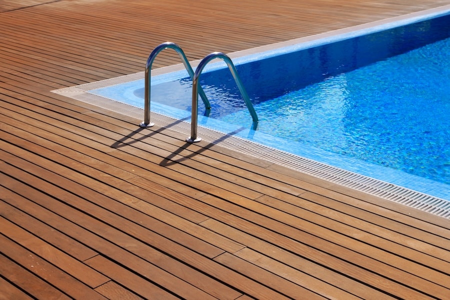 blue-swimming-pool-with-teak-wood-flooring-2