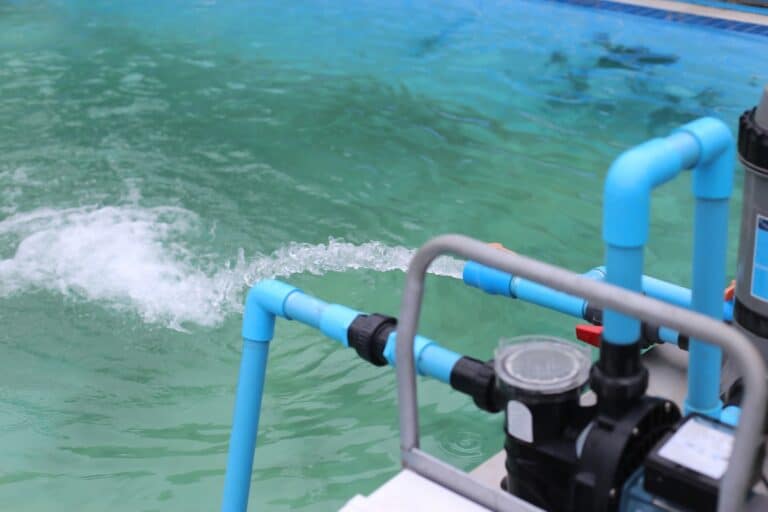 Water pump pumping water into the pool.